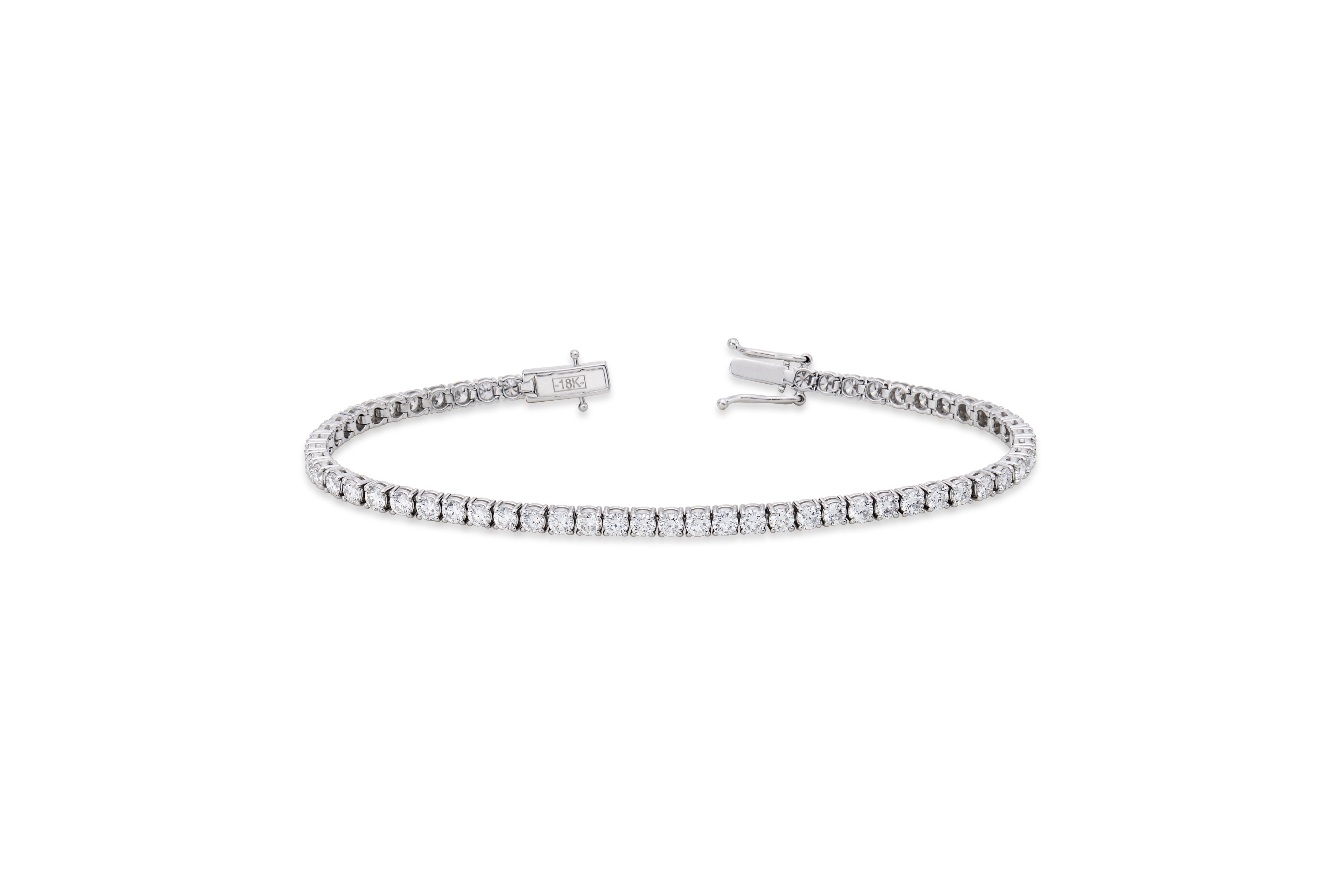 Round diamond tennis bracelet in a four-prong setting by EMBLUME
