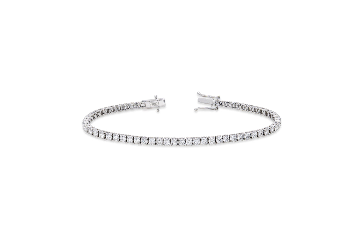Round diamond tennis bracelet in a four-prong setting by EMBLUME